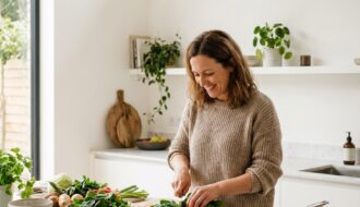 An aesthetic food layout featuring vibrant organic kale, fresh spinach, and hormone-supporting anti-inflammatory foods, highlighting dietary choices for perimenopause and estrogen balance.